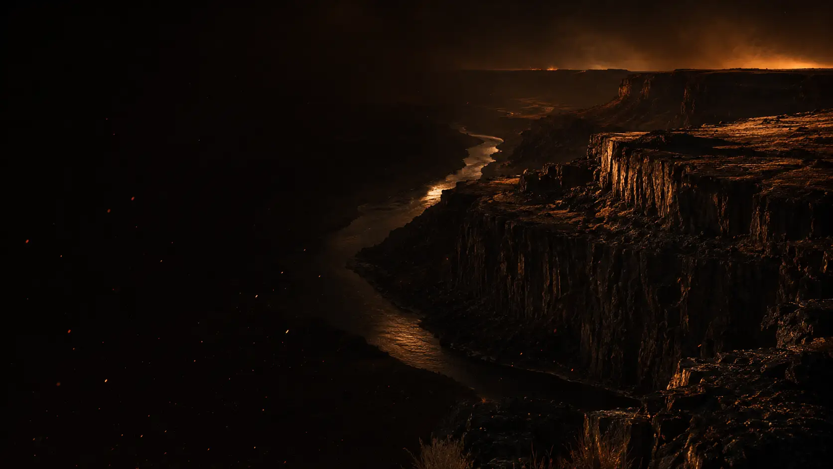 The Snake River Canyon near Twin Falls, Idaho at dusk, the river winding far below the basalt rim